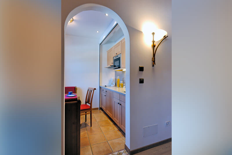 Kitchen and dining room from the corridor Holiday flat A - Hotel Hubertushof